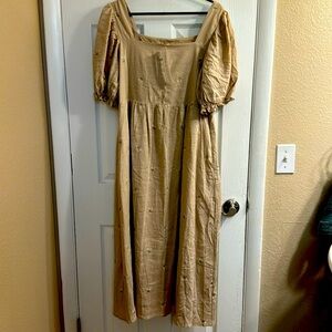 Beautiful tan dress with delicate flowers embroidered throughout. New with tags